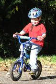 young boy riding a bicycle